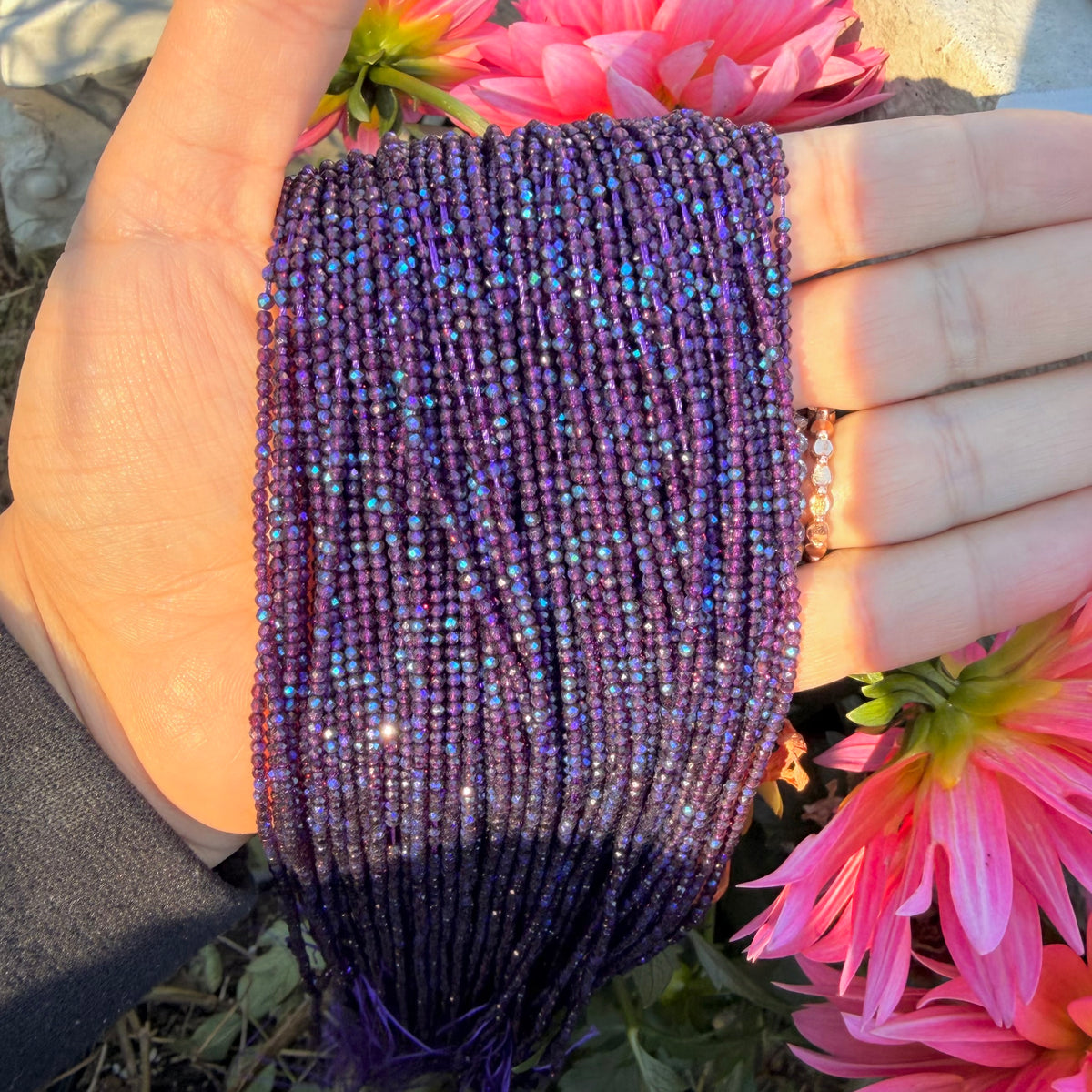Nior Plum 2mm faceted glass bead with Blue Iridescent Ab Finish