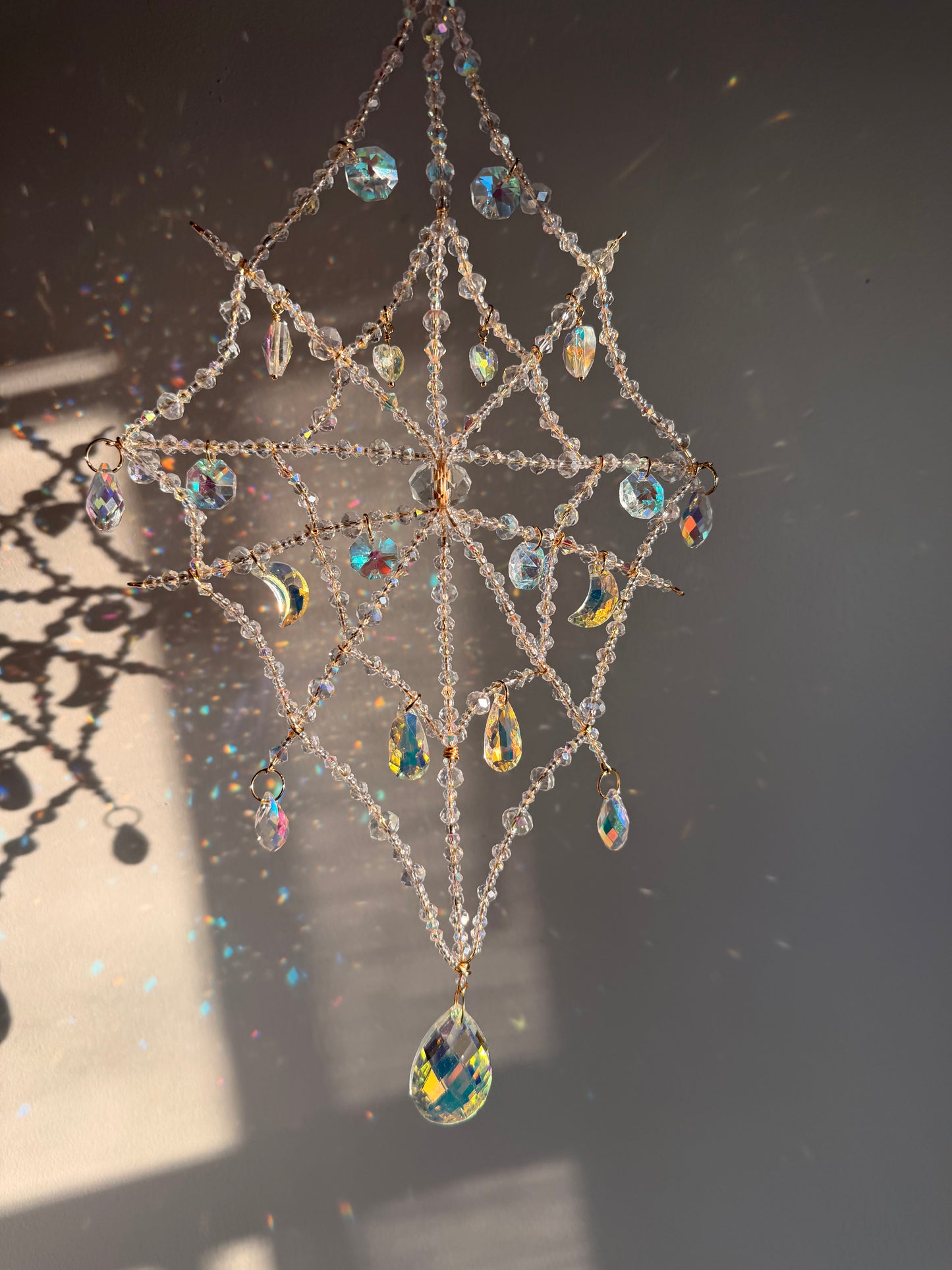 Tear drop spider web suncatcher