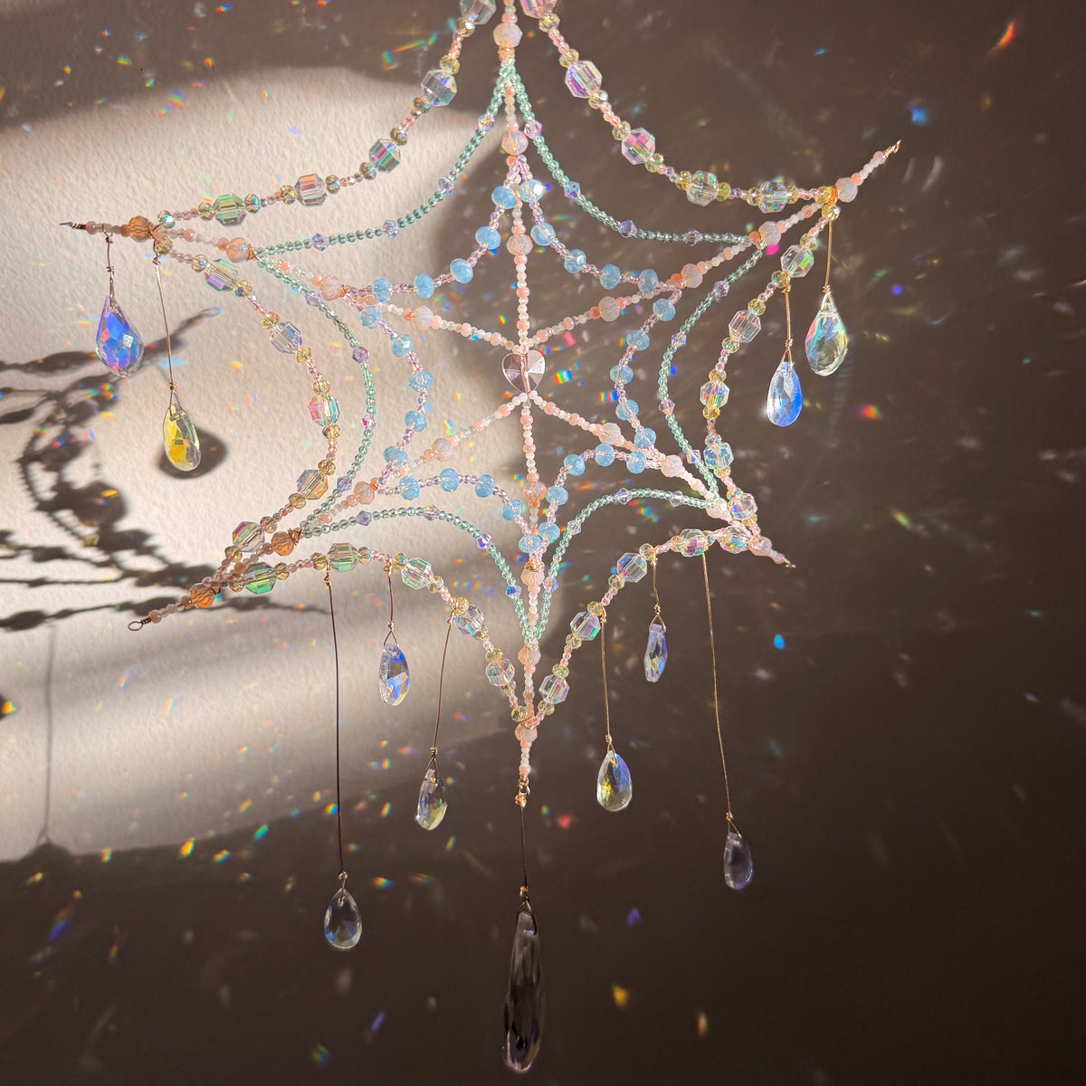Woven in starlight | spider web suncatcher