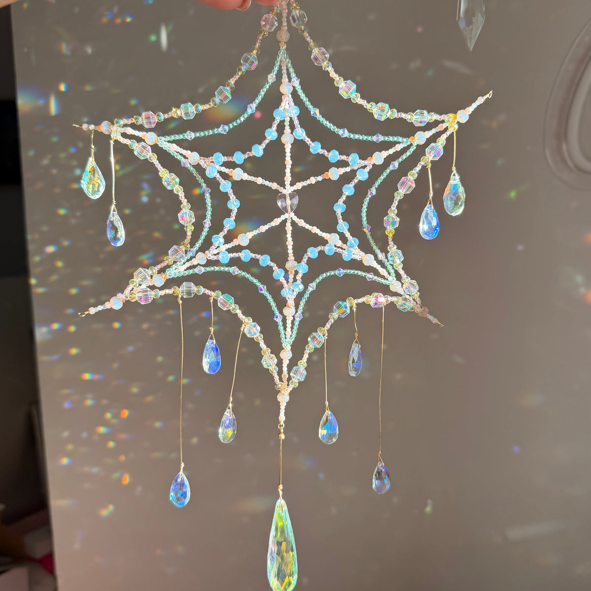Woven in starlight | spider web suncatcher