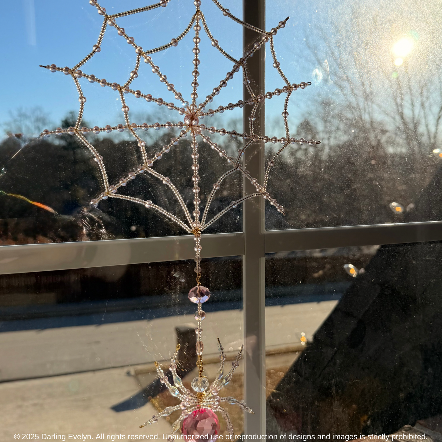 Handmade pretty in pink spider web suncatcher