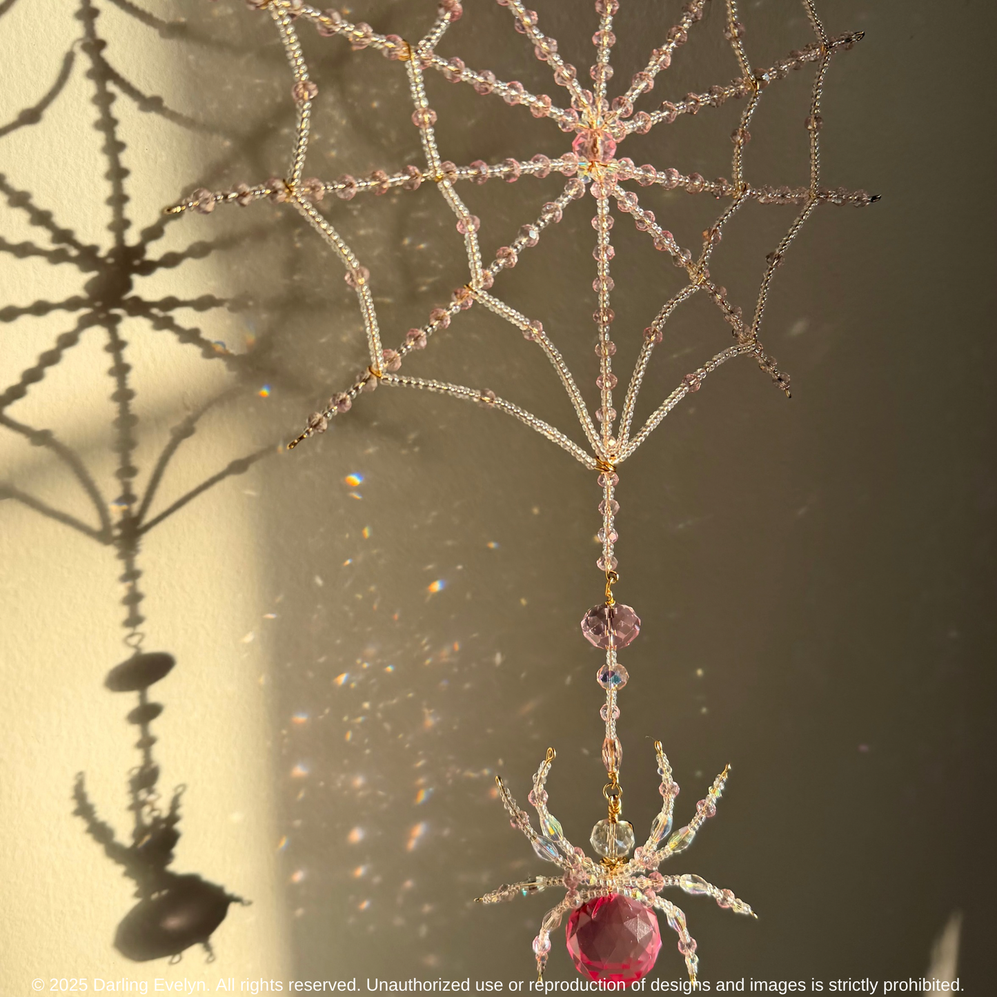 Handmade pretty in pink spider web suncatcher
