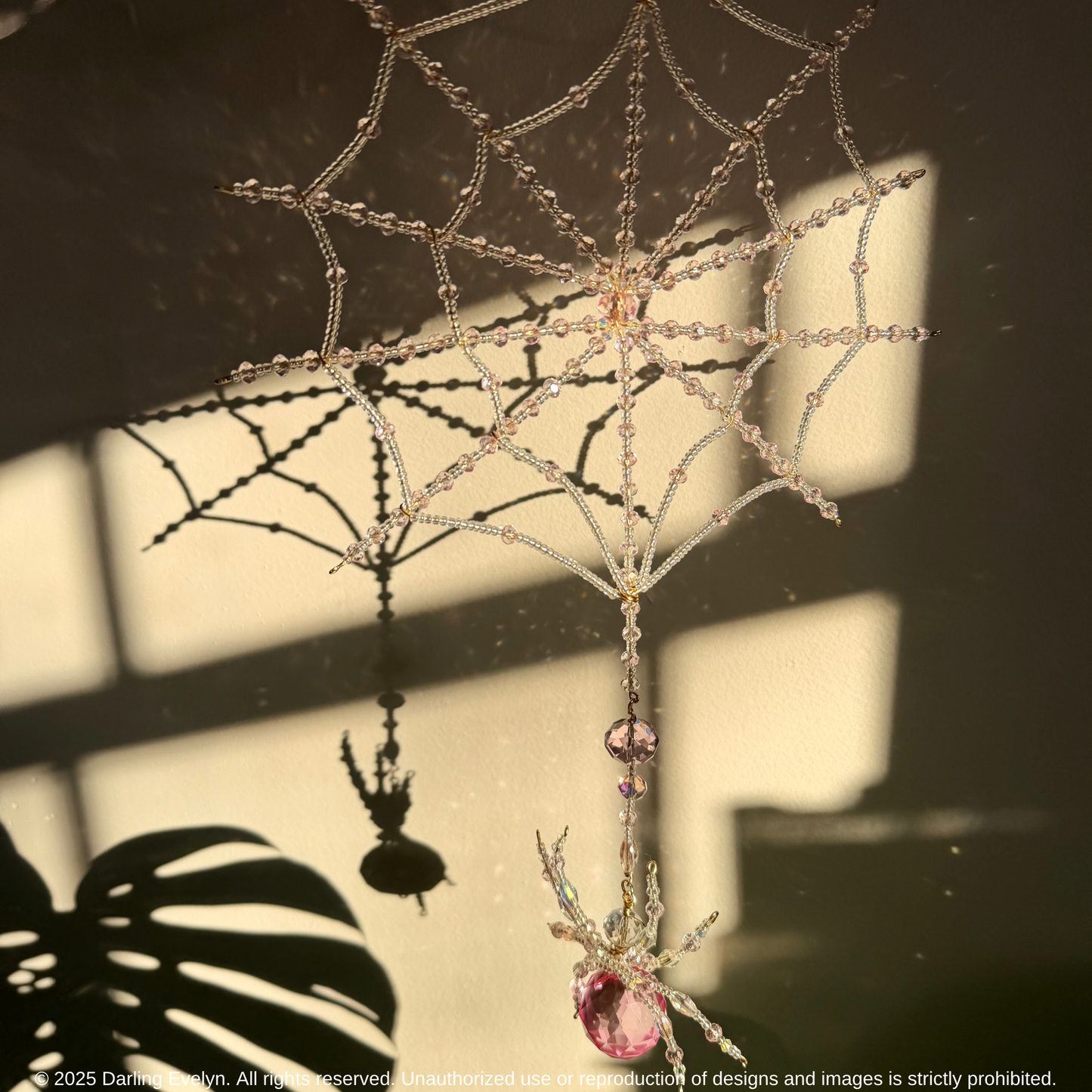 Handmade pretty in pink spider web suncatcher